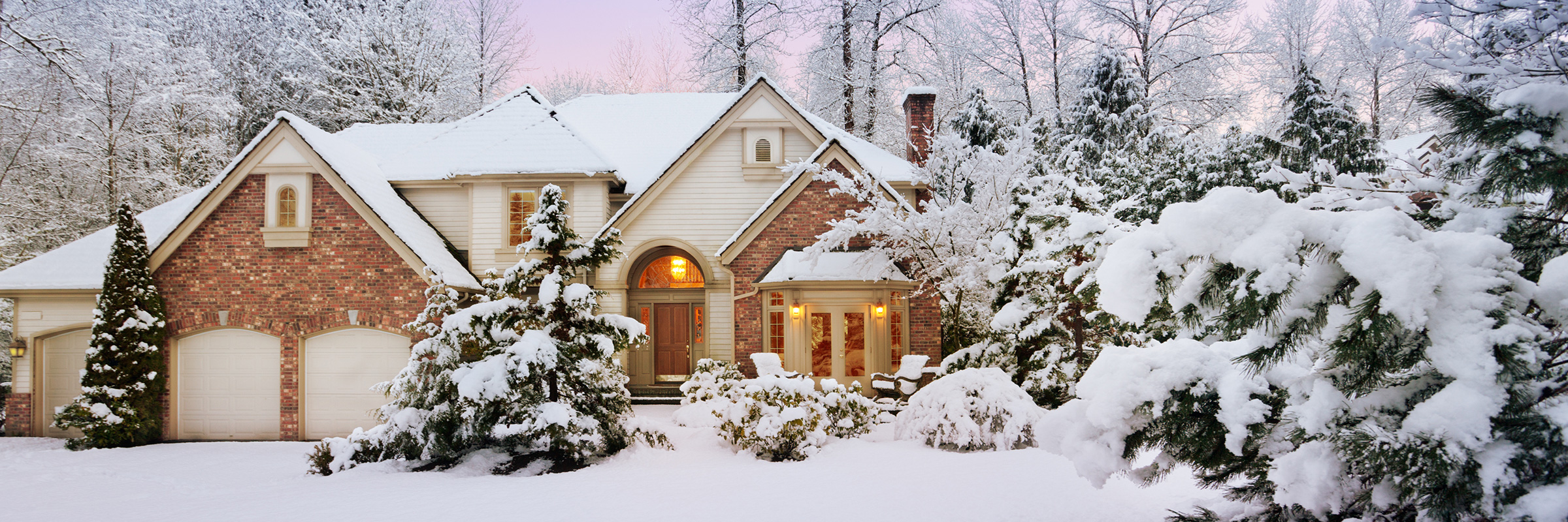 Brick house covered in heavy snow