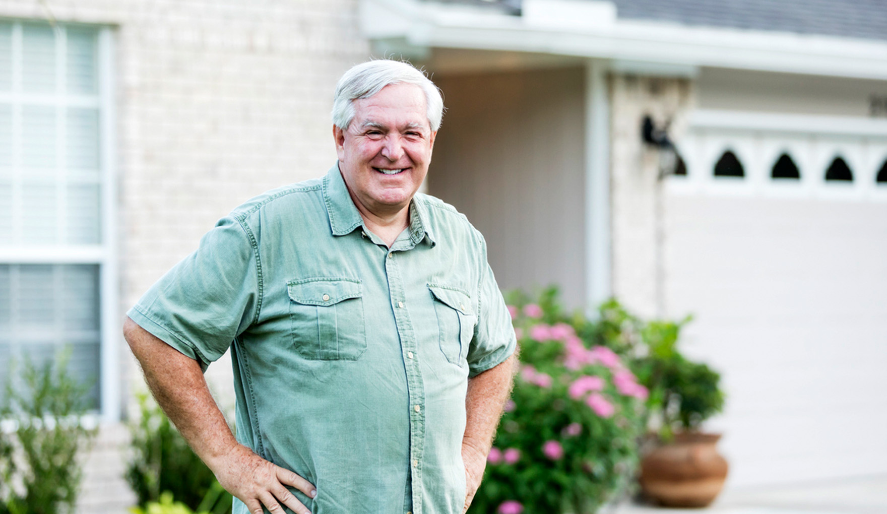 man in front of house