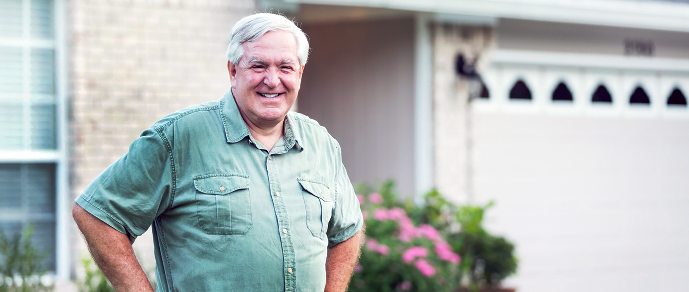 man in front of house