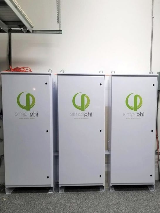 Three AccESS energy storage system cabinets