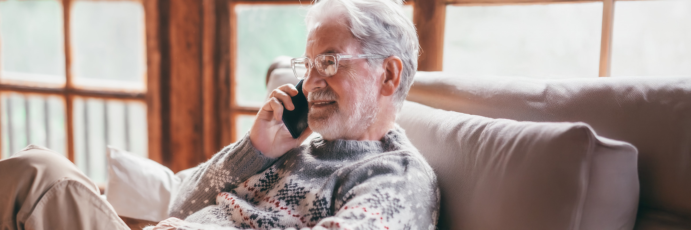 Red house in the winter covered in snow