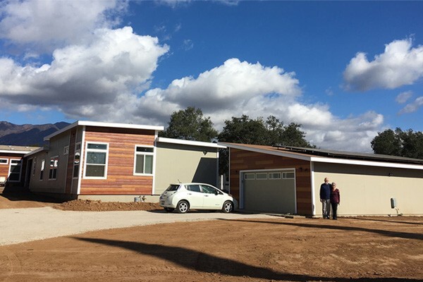 Beverly and Pierre with their prefab home