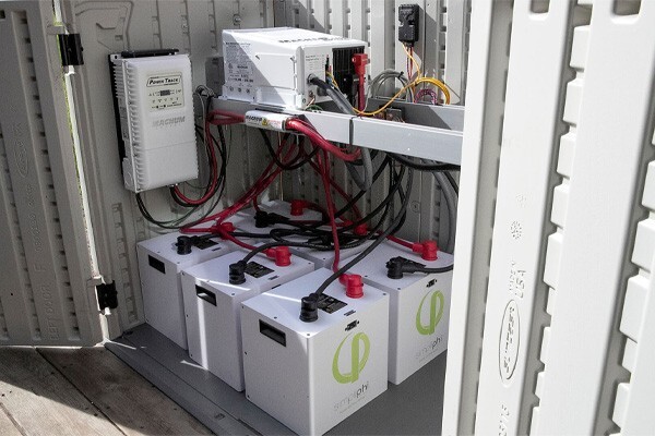 Inside a shed, showing the battery system setup