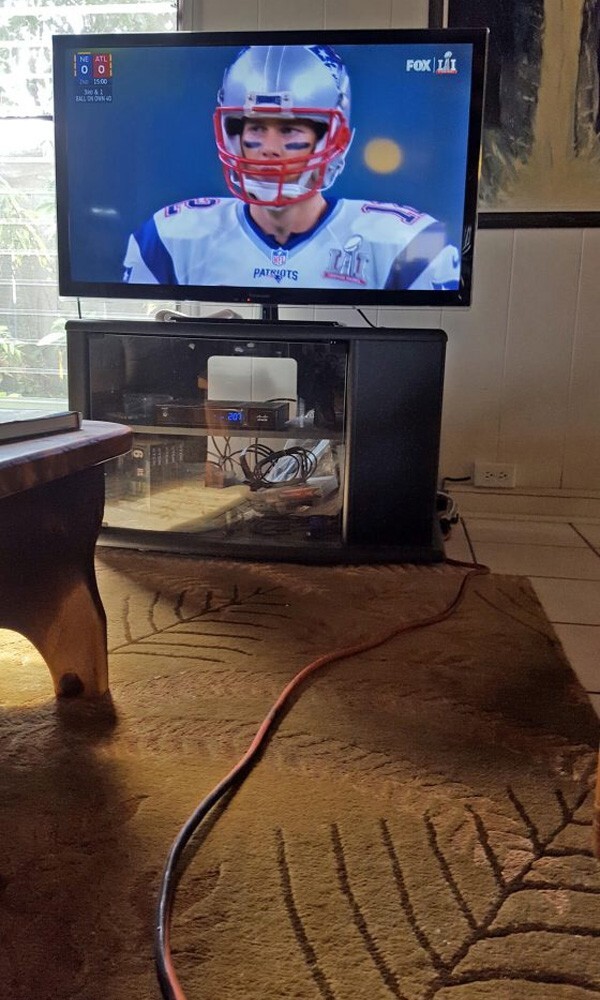 Extension cord running to neighbor's house, powering TV to watch the Superbowl