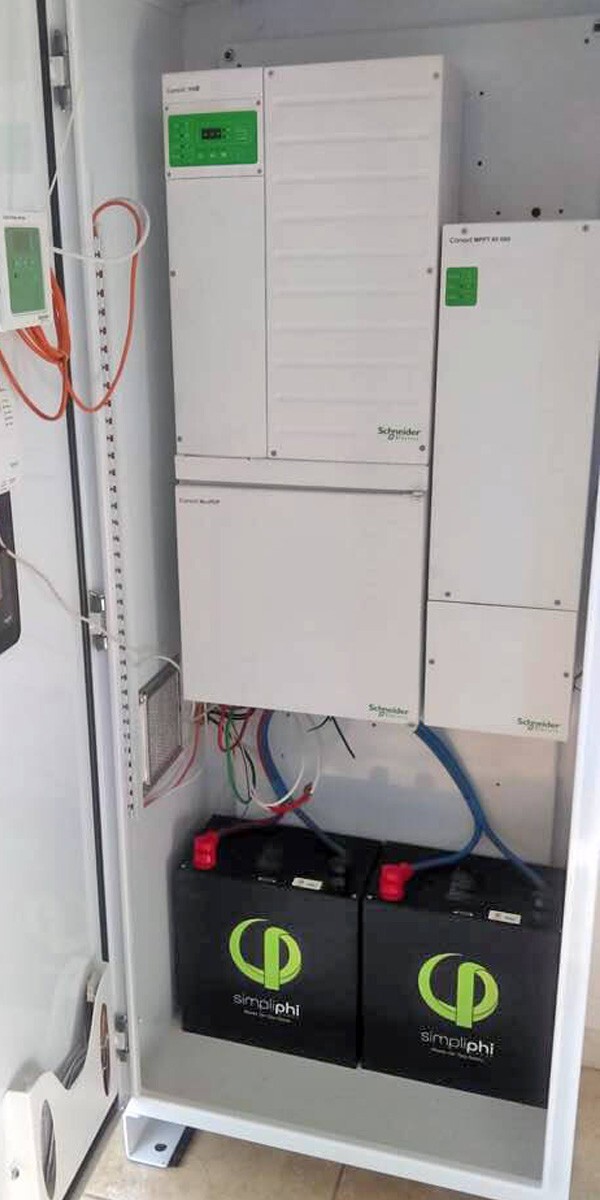 Schneider inverter and PHI batteries inside AccESS cabinet