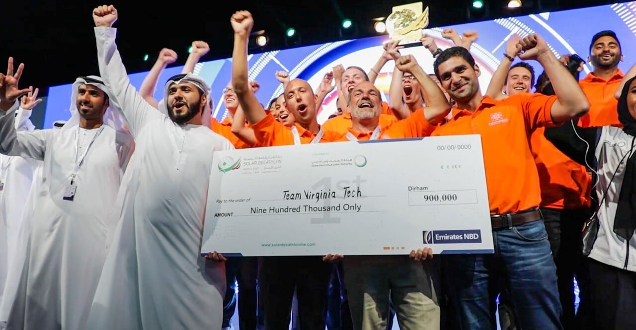 Winning Virginia Tech team holding prize