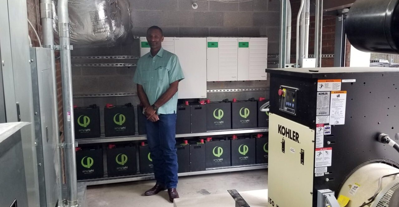 Person with PHI batteries in the battery storage system setup