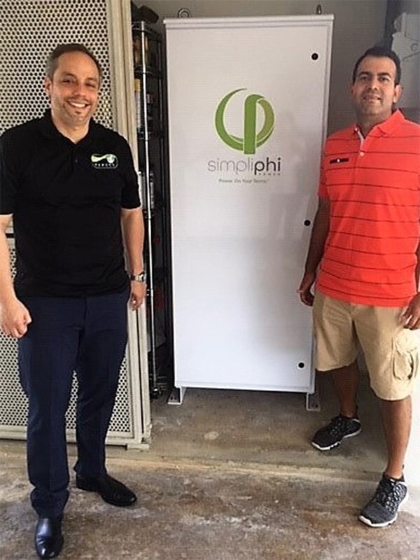 Homeowner and installer with new AccESS energy storage system