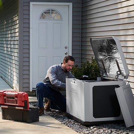 man working on generator