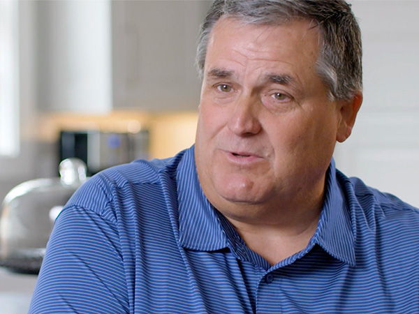 John Thrasher sitting at his kitchen island being interviewed.