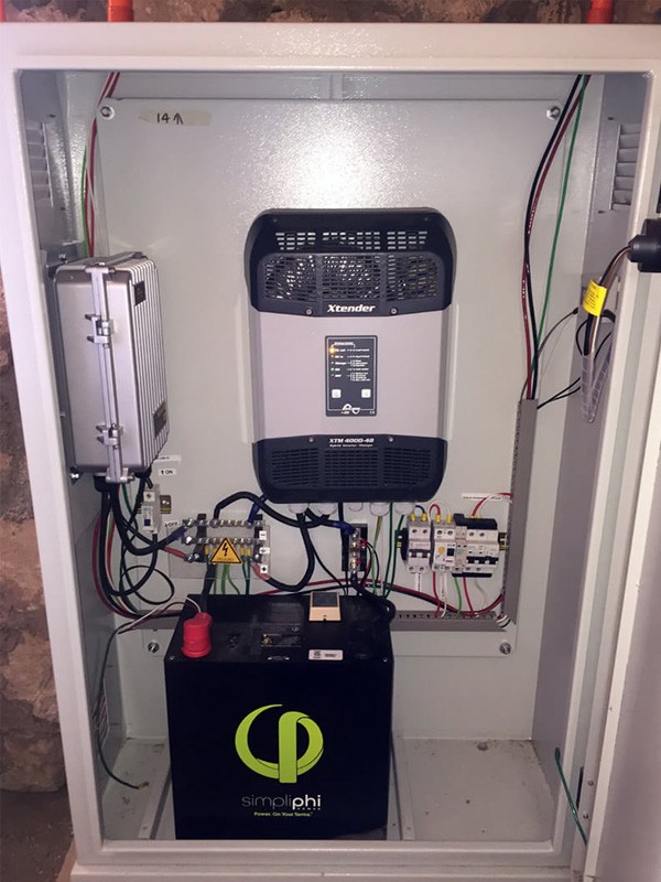 48V PHI 3.4kWh LFP battery, inverter, and charge controller in a small cabinet