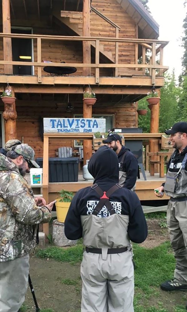 Group of veterans outside main lodge