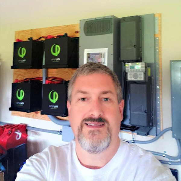 Homeowner with newly installed PHI batteries and battery storage system